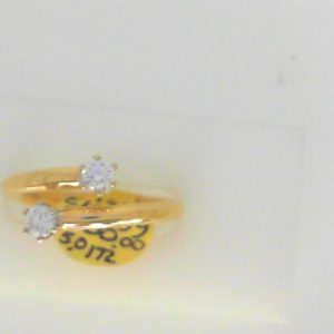 Estate Diamond Dinner Ring - Women's 
14 Karat Yellow/White Estate Dinner Ring Width 2.4mm 
Finger Size 7 Gram Weight 5 
2 Center Diamonds Shape: Round; Clarity: SI1; Colour: H 0.37