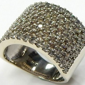 Estate Diamond Dinner Ring - Women's 
14 Karat White Estate Dinner Ring Width 14.8mm 
Finger Size 6.75 Gram Weight 9 
140 Center Diamonds Shape: Round; Clarity: SI-I1; Colour: K/L 2