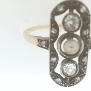 Estate Diamond Dinner Ring - Women's 
14 Karat Yellow gold with SilverEstate Dinner Ring 
Finger Size 7.5 
12 Center Diamonds Shape: Old Mine Cut and some Roase Cut 0.25