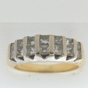 Estate Diamond Dinner Ring - Women's 
18 Karat Yellow/White Estate Dinner Ring 
Finger Size 7.5 Gram Weight 6.04 
14 Center Diamonds Shape: Square; Clarity: I1; Colour: I 1