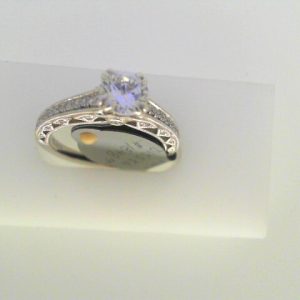 Diamond Semi-Mount Ring 
14 Karat White Ring 
Finger Size 6.25 
1 Center Cubic Zirconium 1.00ct Shape: Round Round Diamond 0.19 ctw 1.19