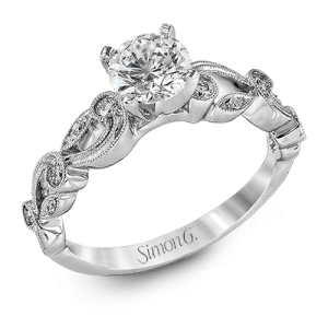 Diamond Semi-Mount Ring 
18 Karat White Ring 
Finger Size 6 
 Center Diamond Shape: Round; Clarity: VS1; Colour: F/G 0.15