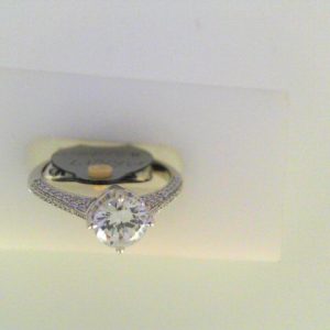 Diamond Semi-Mount Ring 
18 Karat White Ring 
Finger Size 6 
 Center Diamond Shape: Round; Clarity: VS1; Colour: F/G 0.22