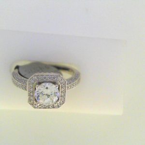 Diamond Semi-Mount Ring 
18 Karat Rose/White Ring 
Finger Size 6 
 Center Diamond Shape: Round; Clarity: VS1; Colour: F/G Round Diamond 0.03 ctw 0.77