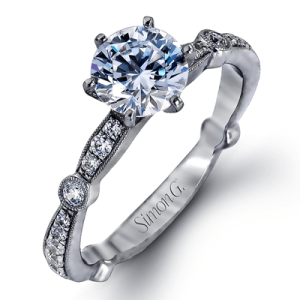 Diamond Semi-Mount Ring 
18 Karat White Ring 
Finger Size 6 
 Center Diamond Shape: Round; Clarity: VS1; Colour: F/G 0.3
