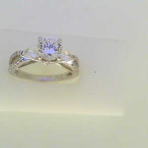 Diamond Semi-Mount Ring 
18 Karat White Ring 
Finger Size 7 
 Center Diamond Shape: Various Shapes; Clarity: VS1; Colour: F/G 0.78