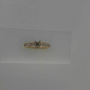 Diamond Semi-Mount Ring 
14 Karat Yellow/White Ring 
Finger Size 5.5 Gram Weight 2.79 
 Center Diamond Shape: Round 0.22