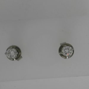 Estate Diamond Earrings 
14 Karat White Estate Diamond Earrings 
 
2 Center Diamonds 0.24ct Shape: Round; Clarity: VVS; Colour: G/H 0.49