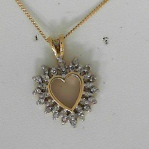 Estate Diamond Pendant/Necklace 
14 Karat Yellow Estate Diamond Pendant 
Gram Weight 3.1 Chain Style: Curb 14 Karat Yellow 18 
30 Center Diamonds Shape: Round 0.25