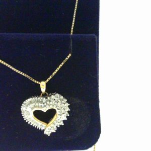 Estate Diamond Pendant/Necklace 
10 Karat Yellow/White Estate Diamond Pendant 
Gram Weight 5 Chain Style: Box 10 Karat Yellow 18 
 Center Diamond Shape: Various Shapes 0.75