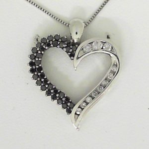 Estate Diamond Pendant/Necklace 
14 Karat White Estate Diamond Pendant 
Gram Weight 2.3 Chain Style: No Chain 
11 Center Diamonds Shape: Round With 34 Round Diamonds