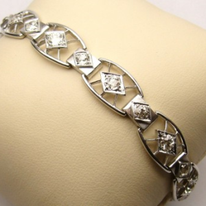 Estate Diamond Bracelet 
14 Karat White Estate Diamond Bracelet Length: 7in Width: 11mm 
Gram Weight 17.2 
18 Center Diamonds Shape: Rose Cut; Clarity: I1; Colour: J/K 4