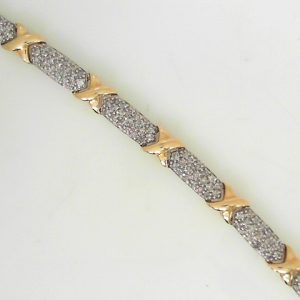 Estate Diamond Bracelet 
10 Karat Yellow/White Estate Diamond Bracelet Length: 7.5in Width: 8.1mm 
Gram Weight 21.3 
152 Center Diamonds Shape: Round; Clarity: I2; Colour: I 5