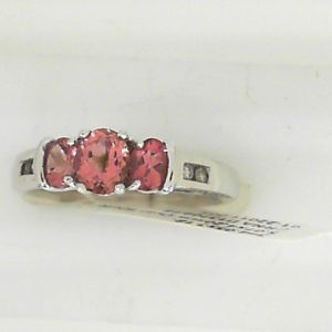 Tourmalines Ring 
10 Karat White Pink Tourmalines Ring With Finger Size 6.25 
Width 2.38mm Gram Weight 2.97 
3 Center Tourmalines Shape: Oval; Colour: Pink With 4 Round Diamonds