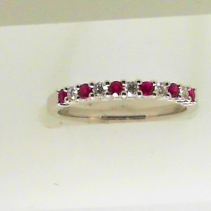 Rubies Ring 
18 Karat White Rubies Ring With Finger Size 6.5 
 
6 Center Rubies Shape: Round With 5 Round Diamonds
