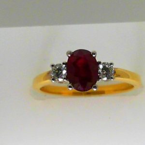 Ruby Ring 
18 Karat Yellow/White Ruby Ring With Finger Size 7 
 
1 Center Ruby 1.13ct Shape: Round With 2 Round Diamonds 0.19 ctw