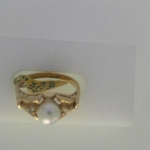 Pearl Estate Ring 
10 Karat Yellow Pearl Ring With Finger Size 6.25 
Width 2.04mm Gram Weight 2.15 
1 Center Pearl Shape: Round With 2 Round Diamonds 0.01 ctw