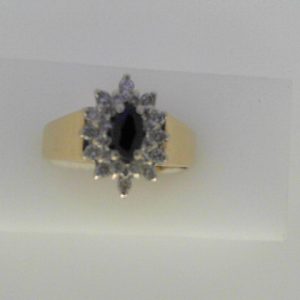 Sapphire Estate Ring 
14 Karat Yellow/White Sapphire Ring With Finger Size 10 
Width 3.15mm Gram Weight 5.81 
1 Center Sapphire Shape: Marquise With 24 Round Diamonds 0.25 ctw