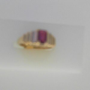 Ruby Estate Ring 
14 Karat Yellow Ruby Ring With Finger Size 5 
Width 1.66mm Gram Weight 3.31 
1 Center Ruby 0.43ct Shape: Emerald With 18 Round Diamonds 0.10 ctw