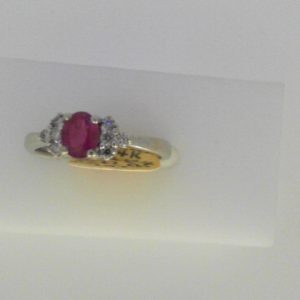 Ruby Estate Ring 
14 Karat White Ruby Ring With Finger Size 6.75 
Width 2.31mm Gram Weight 2.48 
1 Center Ruby 0.35ct Shape: Oval With 8 Round Diamonds 0.10 ctw