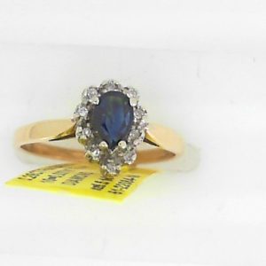 Sapphire Estate Ring 
10 Karat Yellow/White Sapphire Ring With Finger Size 6.5 
Width 1.73mm Gram Weight 2.09 
1 Center Sapphire 0.29ct Shape: Pear With 10 Round Diamonds 0.03 ctw