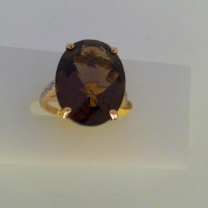 Rose Quartz Estate Ring 
14 Karat Yellow Rose Quartz Ring With Finger Size 5 
Width 1.6mm Gram Weight 4.2 
1 Center Rose Quartz 7.00ct Shape: Oval With 20 Round Diamonds