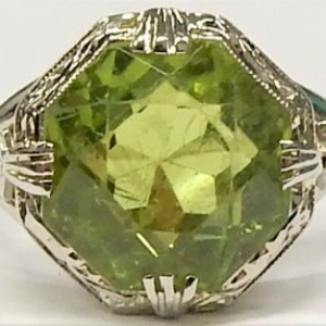 Peridot Estate Ring 
14 Karat White Green Peridot Ring With Finger Size 5.5 
 Gram Weight 4.7 
1 Center Peridot 4.37ct Shape: Various Shapes; Colour: Green