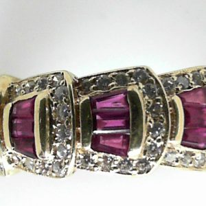 Rubies Estate Ring 
18 Karat Yellow Rubies Ring With Finger Size 6.5 
 Gram Weight 4.2 
12 Center Rubies Shape: Various Shapes With 48 Round Diamonds