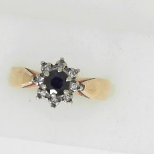 Sapphire Estate Ring 
14 Karat Yellow Blue Sapphire Ring With Finger Size 7.75 
 Gram Weight 3.57 
1 Center Sapphire Shape: Round; Colour: Blue With 8 Round Diamonds 0.08 ctw