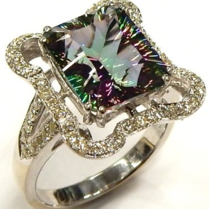Topaz Estate Ring 
14 Karat White Topaz Ring With Finger Size 9 
 Gram Weight 7.86 
1 Center Topaz 5.50ct Shape: Fantasy Cut With 56 Round Diamonds 0.50 ctw