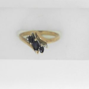 Sapphires Estate Ring 
10 Karat Yellow Blue Sapphires Ring With Finger Size 6.5 
 Gram Weight 1.88 
3 Center Sapphires Shape: Marquise; Colour: Blue With 2 Round Diamonds
