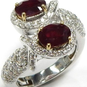 Rubies Estate Ring 
18 Karat White Red Rubies Ring With Finger Size 7.5 
 Gram Weight 9.62 
2 Center Rubies Shape: Oval; Colour: Red With 91 Round Diamonds 1.36 ctw