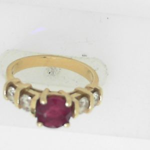 Ruby Estate Ring 
14 Karat Yellow Ruby Ring With Finger Size 6 
 Gram Weight 4.2 
1 Center Ruby 0.91ct Shape: Round With 4 Round Diamonds 0.55 ctw
