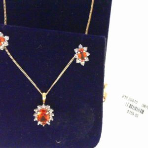 Earrings with Citrines 
14 Karat Yellow/White Citrines Earrings 
 Gram Weight 1.2 
2 Center Citrines Shape: Oval Round Diamond 0.14 ctw