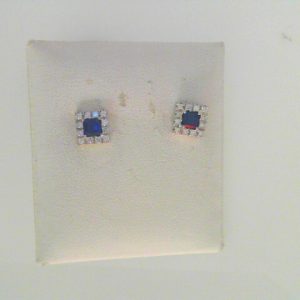 Earrings with Sapphires 
14 Karat White Sapphires Earrings 
 Gram Weight 2.49 
2 Center Sapphires Shape: Princess With 24 Round Diamonds 0.24 ctw