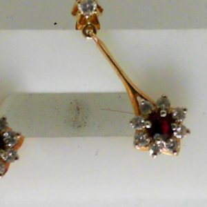 Estate Earrings With Rubies 
14 Karat Yellow Rubies Earrings 
 Gram Weight 3.1 
2 Center Rubies Shape: Round With 18 Round Diamonds 0.63 ctw