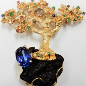 Diamond Estate Pendant 
14 Karat Yellow Diamond Pendant 
Gram Weight 42.06 Chain Style: No Chain 
1 Center Diamond 1.50ct Shape: Round; Clarity: I1 With 1 Oval Tanzanite 5.50 ctw and 5 Round Rubies and 19 Round Emeralds and 6 Round Sapphires and 3 Roun