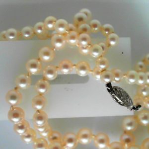 Pearls Estate Pendant 
10 Karat White Pearls Pendant 
 Chain Style: Fancy Link Length: 19in 
83 Center Pearls Shape: Round