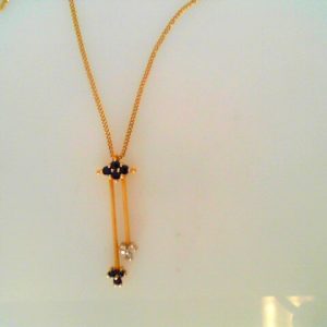 Sapphires Estate Pendant 
14 Karat Yellow Blue Sapphires Pendant 
Gram Weight 2.5 Chain Style: Curb 14 Karat Yellow Length: 18in 
7 Center Sapphires Shape: Round; Colour: Blue With 3 Round Diamonds