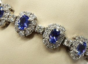 Estate Bracelet With Tanzanites 
14 Karat White Tanzanites Bracelet Length: 7in 
Gram Weight 34.3 
13 Center Tanzanites Shape: Oval With 142 Round Diamonds 7.42 ctw