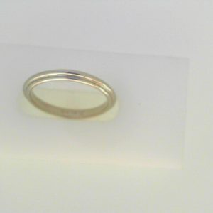 White 18 Karat Polished Band Ring 
Size: 6 
Gram Weight 2.47 gr