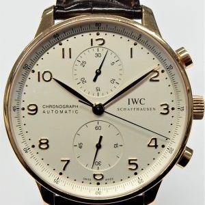 Gents IWC Portugese chronograph on strap with box and papers, extra strap. IW371480 SN 3603277
Gents Estate Watch - Misc IWC Dress 
Vendor Style #: IW371480 3603277
 18 Karat Strap 
Dial:
Box Included/Papers Included
Condition 
1 Year Warranty