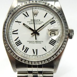 Estate Rolex Dress Year: 1970
Vendor Style #: Rolex Datejust 1603 Engine turned bezel SN: 2547396 Jubilee
36mm StainlessSteel
Dial: White Roman Buckley 
Box Not Included/Papers Included. Aug. 2022 Rolex factory service with new dial.
Condition Good 1