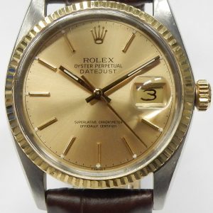 Estate Rolex Dress Year: 1978
Vendor Style #: 16013 Datejust quick set two tone SN: 5652857 Strap
36mm 18K/Stainless Steel
Dial: Champagne hash 
Box Not Included/Papers Not Included/2021 Rolex service papers
Condition Very Good
1 Year Warranty